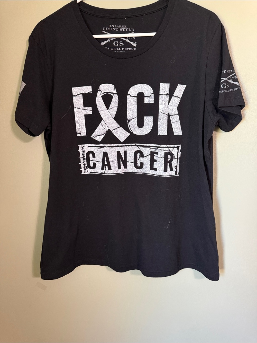 WOMAN’S GRUNT STULE F CANCER TSHIRT-
TAGGED XXL FITS TIGHT WORE ONCE -
